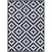 A black and white Couristan Afuera Diatomic area rug with a geometric pattern.