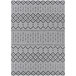 A Couristan Hadron runner rug with a black and white geometric pattern.