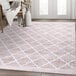 A cream Abani Parker Collection area rug with a modern trellis pattern.
