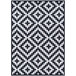 A Couristan Afuera Diatomic area rug with a black and white geometric pattern.