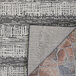 A close up of a Couristan Everhome Tangent area rug with a stone pattern in charcoal and ivory.