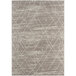 An Abani Casa Collection beige rug with a geometric tribal pattern.