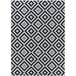 A black and white Couristan Afuera area rug with a diamond pattern.