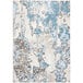 An Abani Arto teal and beige area rug with abstract designs in blue and white.