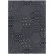 A close up of a Couristan Afuera Anode black and white hexagon patterned rug.