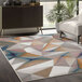 A multicolor Abani Arto Collection area rug with geometric shapes, including triangles.