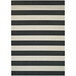 A black and white striped Couristan area rug with a white border.