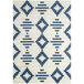 A close up of an Abani Casa Collection navy and cream area rug with a geometric design in a room with white walls.