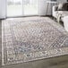 An Abani Lola Collection brown vintage area rug with a geometric medallion design on a floor.