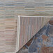 A close up of the Couristan Cape Fayston multi-colored stripe area rug.