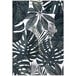 A cream rug with green tropical leaves on it.