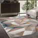 A multicolor Abani Arto Collection area rug with contemporary 3D geometric shapes including triangles.