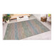 A Couristan Cape Fayston area rug with a multicolored pattern on the floor.