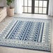 An Abani Casa Collection navy and cream rug with a Southwestern geometric design.