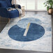 An Abani Atlas Collection blue and gray area rug with intertwined circles in a room.