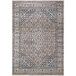 An Abani Lola Collection brown vintage geometric medallion area rug with a beige and grey pattern.