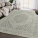 An Abani Cabo Collection cream and gray area rug with a hexagon medallion design.