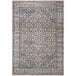 An Abani Lola brown vintage area rug with a beige and grey geometric medallion pattern.