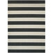 A black and white striped Couristan area rug with a white border.