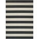 A black and white striped Couristan area rug with a white border.