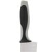 A Dexter-Russell V-Lo Santoku chef knife with a black and white blade and handle.