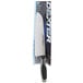 A Dexter-Russell V-Lo Santoku chef knife in a package with a white and blue box.