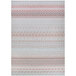 A Couristan runner rug with an orange and white geometric pattern on a white background.