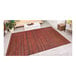 A Couristan Cape Hinsdale runner rug with red stripes on the floor.