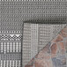 A Couristan Bristol area rug with a pattern in charcoal and ivory.