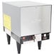 A silver Hatco compact booster water heater with black legs.