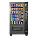 A Seaga vending machine filled with snacks and chips.