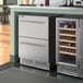 An AvaValley stainless steel wine fridge with two drawers.