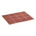 A red rubber Lavex anti-fatigue floor mat with holes in it.