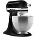 A close-up of a black and silver KitchenAid K45SSOB countertop mixer.