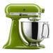 A KitchenAid matcha green mixer with a bowl on top.