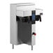 A white Fetco commercial coffee machine with a water dispenser on top.