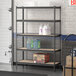 A Lavex black Z-beam boltless shelf with containers on it.