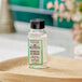 A case of 170 JR Watkins Aloe and Green Tea Shower Gel bottles on a wood surface.
