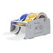 A roll of labels in a Tach-It mechanical label dispenser.