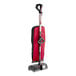 A red and black Hoover Superior Lite upright vacuum cleaner.