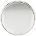 A Gobel round fluted tin-plated steel tart/quiche pan with a removable bottom.