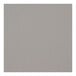 A close-up of a grey surface with a smooth stone grey square table top.