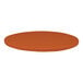 A close-up of a round tangerine Perfect Tables table top with a microtexture.