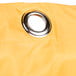 A close-up of a yellow vinyl bag with a metal ring.