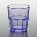 A clear plastic tumbler with a blue rim.