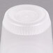 A Newspring translucent plastic deli container with a lid on top.