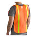 A person wearing an orange high visibility mesh safety vest with 1-inch reflective tape.