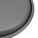 An American Metalcraft hard coat anodized aluminum pizza pan with a grey circular object.