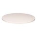 A white round Perfect Tables outdoor table top with a microtexture.