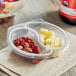 Two plastic containers with Sargento Balanced Breaks, white cheddar, almonds, and cranberries.